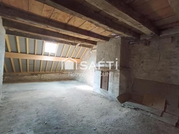 Proche Buxy, immeuble avec appartement et local commercial loué.