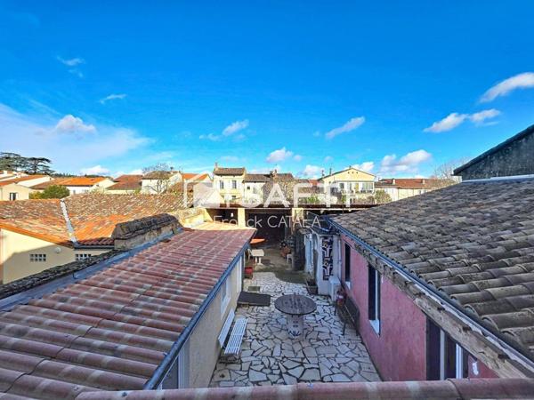 Immeuble avec local commercial loué