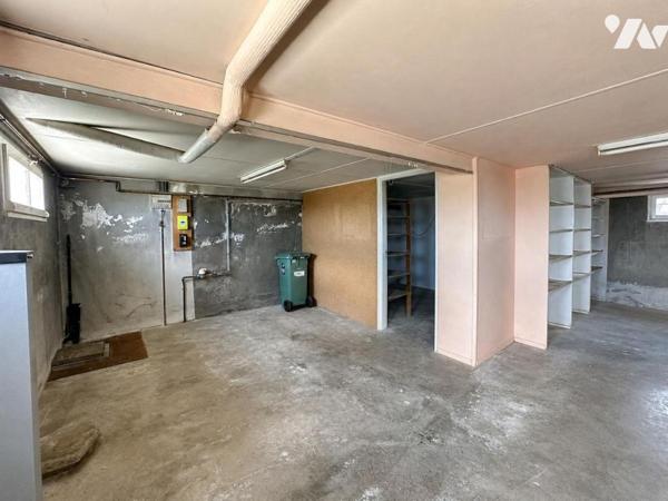 Maison de type T6 avec garage, terrasse et jardin