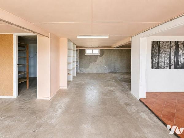 Maison de type T6 avec garage, terrasse et jardin