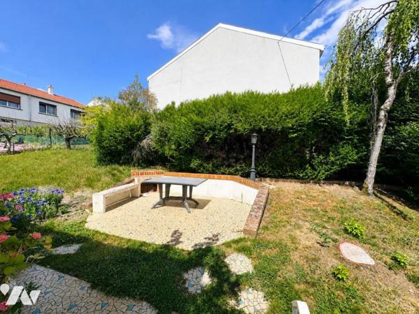 Maison de type T6 avec garage, terrasse et jardin