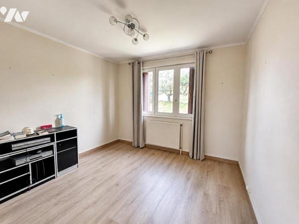 Maison de type T6 avec garage, terrasse et jardin