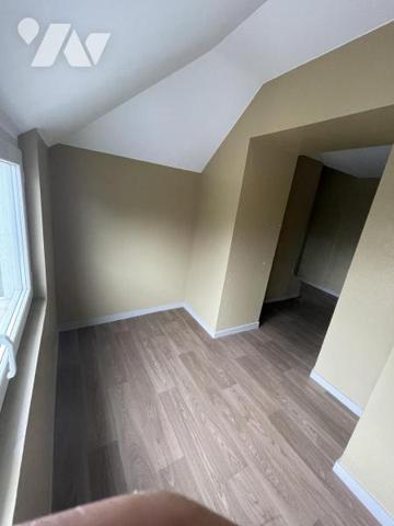 IMMEUBLE A USAGE DE COMMERCE ET D'HABITATION