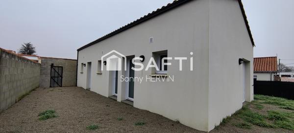 Immeuble de trois appartements de plain-pied + garages