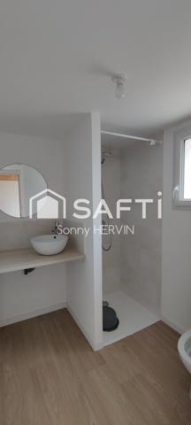 Immeuble de trois appartements de plain-pied + garages