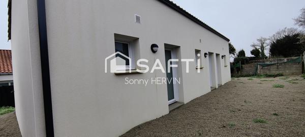 Immeuble de trois appartements de plain-pied + garages