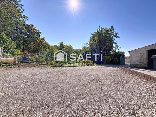 Maison familiale avec garage et terrain