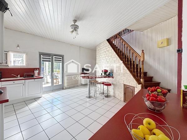 Maison familiale avec garage et terrain