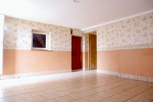 MAISON INDIVIDUELLE AVEC GARAGE ET TERRAIN