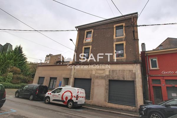 Immeuble composé de 4 bureau et de 3 appartements