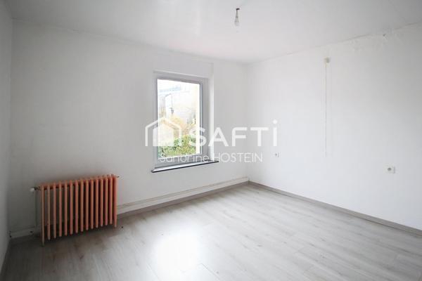 Immeuble composé de 4 bureau et de 3 appartements