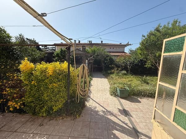 Maison familiale de 105 m² avec 4 chambres, garage motorisé et jardin à Grazailles