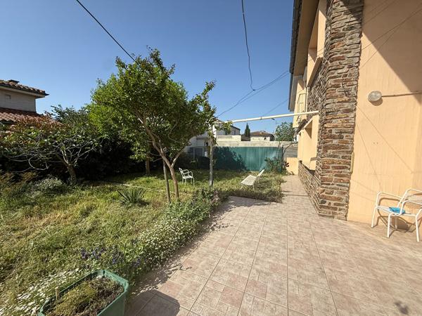 Maison familiale de 105 m² avec 4 chambres, garage motorisé et jardin à Grazailles