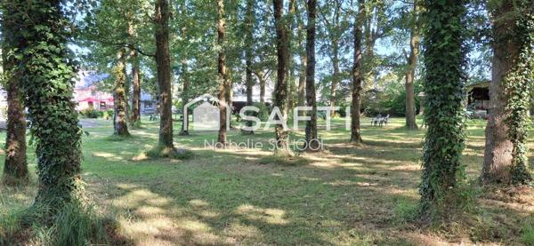 Ensemble immobilier avec restaurant et logement sur un superbe parc arboré