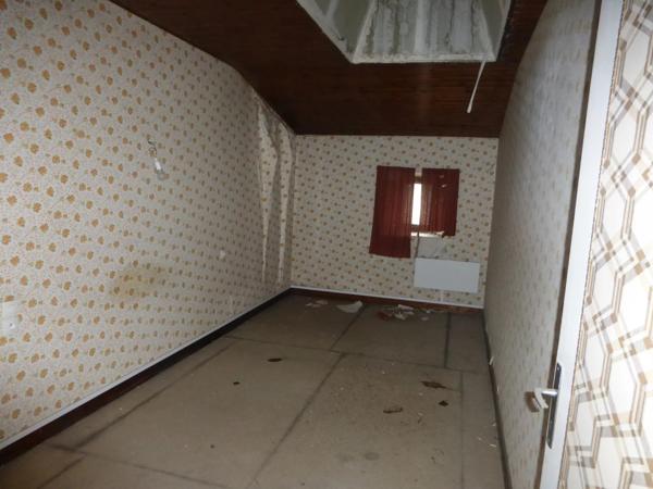 Ancien magasin avec appartement