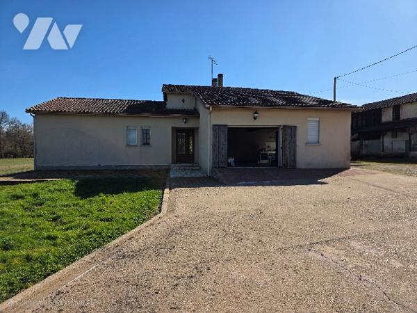 GRANDE MAISON avec dépendance et terrain.