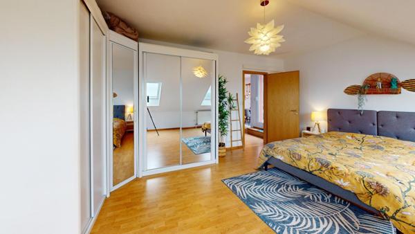 À vendre à Brunstatt : F3 de 77 m² au dernier étage, terrasse 18 m², vue Vosges, garage et ascenseur