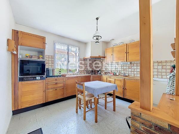 Maison de plain-pied avec jardin et dépendance à Morangis (91)