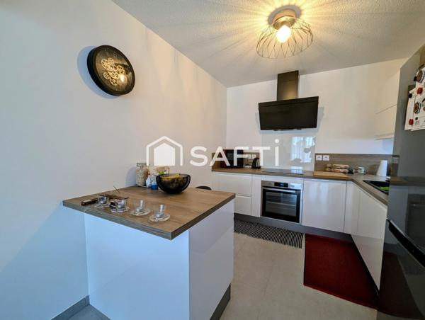 Appartement moderne et confortable avec spacieuse terrasse, garage et cave