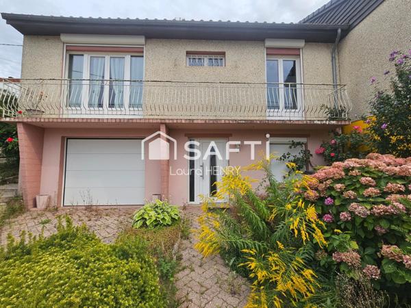 Située dans un quartier calme, maison de 3 chambres avec garage et jardin