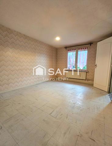 Située dans un quartier calme, maison de 3 chambres avec garage et jardin