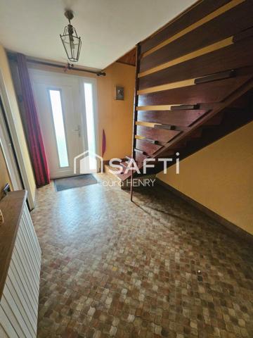 Située dans un quartier calme, maison de 3 chambres avec garage et jardin