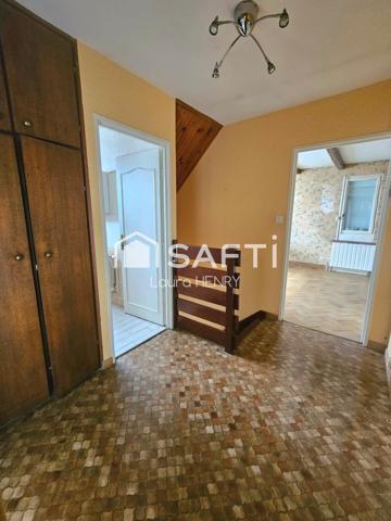 Située dans un quartier calme, maison de 3 chambres avec garage et jardin