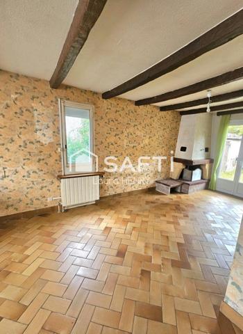 Située dans un quartier calme, maison de 3 chambres avec garage et jardin