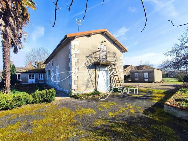 Maison avec dépendances et terrain divisible