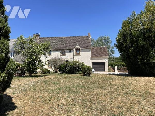 MAISON DE VILLAGE AVEC GARAGE ET JARDIN