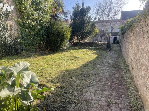 UN APPARTEMENT T4 + CAVE + JARDIN