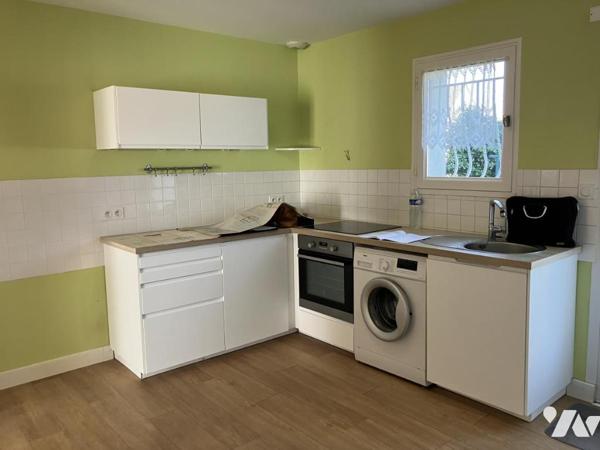 Maison d'habitation avec garage divisée en deux appartements 