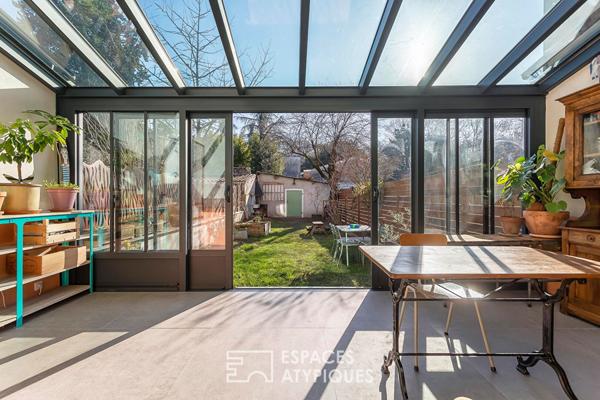 Appartement en rez de jardin esprit maison avec véranda
