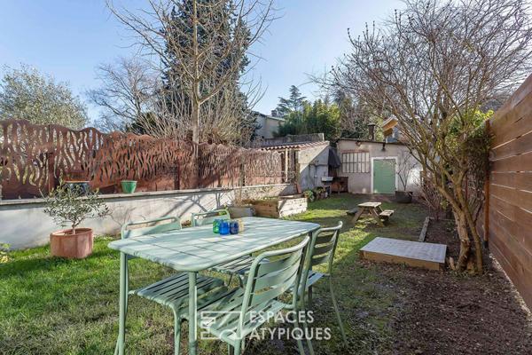 Appartement en rez de jardin esprit maison avec véranda