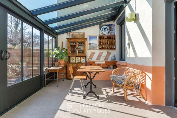 Appartement en rez de jardin esprit maison avec véranda