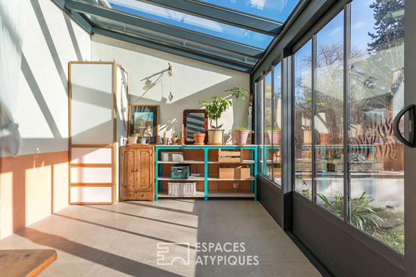 Appartement en rez de jardin esprit maison avec véranda