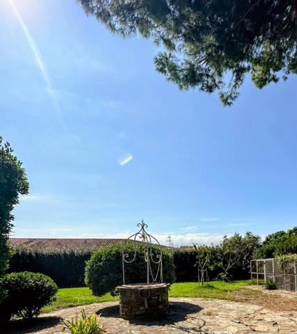Maison 4 faces sur terrain de 3394 m2 (constructible) avec piscine