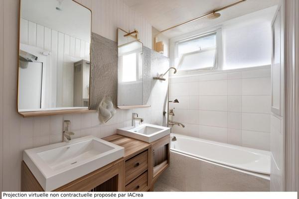 Appartement T4 avec 2 chambres, cave et garage à 15mn du centre ville