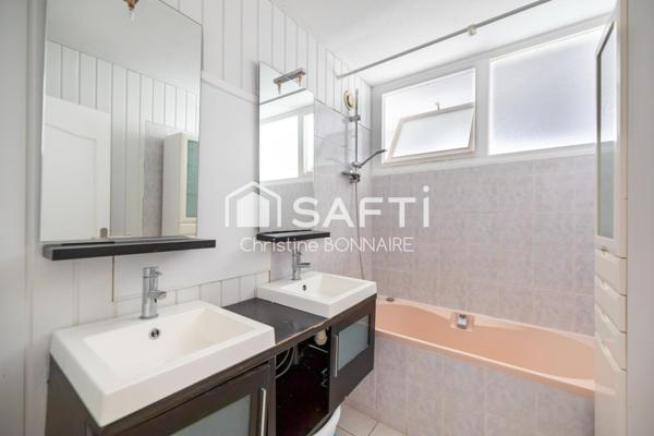 Appartement T4 avec 2 chambres, cave et garage à 15mn du centre ville