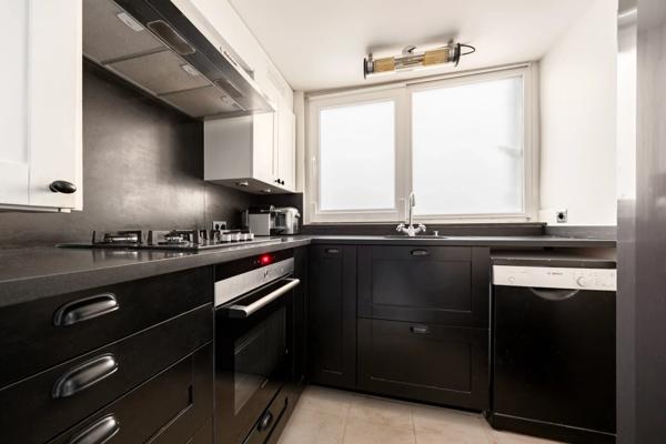 Appartement Paris 7 e - CARRÉ DES ANTIQUAIRES