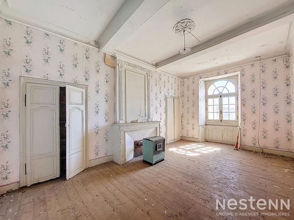 A Vendre Maison en pierre mitoyenne de 165 m² avec jardin proche du centre-ville