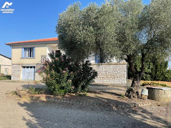 GRANDE MAISON avec jardin et bâtiment.