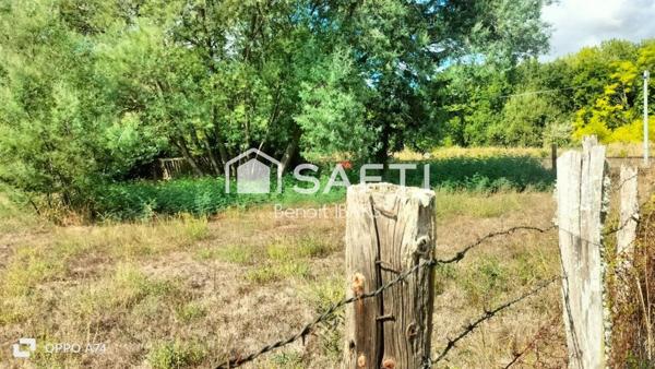 Un terrain clos non constructible, de loisir avec eau de la ville puits et arbres
