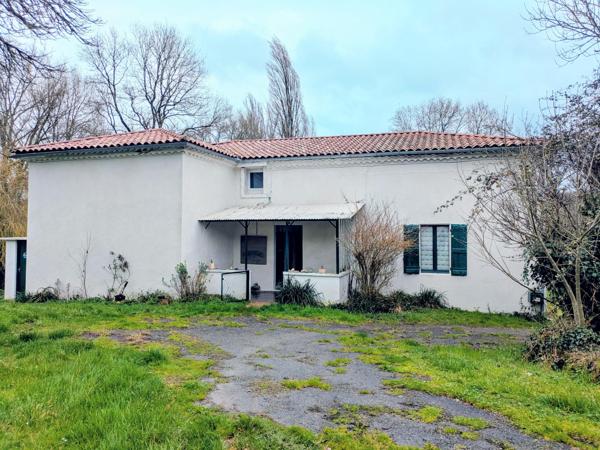 Ferme de caractère avec dépendances et beau potentiel
