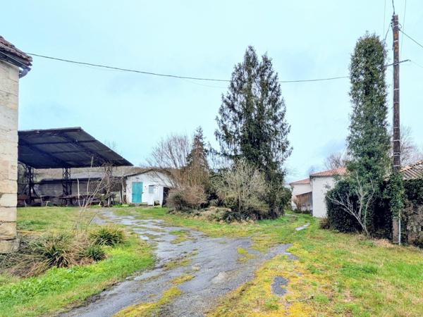 Ferme de caractère avec dépendances et beau potentiel
