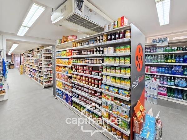 BOULLERET (18) – Immeuble de rapport avec commerces et logement loué