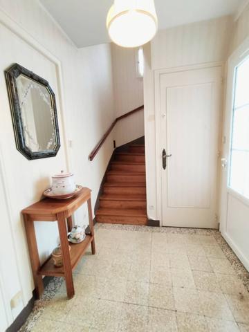 Maison 4 pièces de 75 m² au calme avec garage, sous-sol et terrain de 356 m²