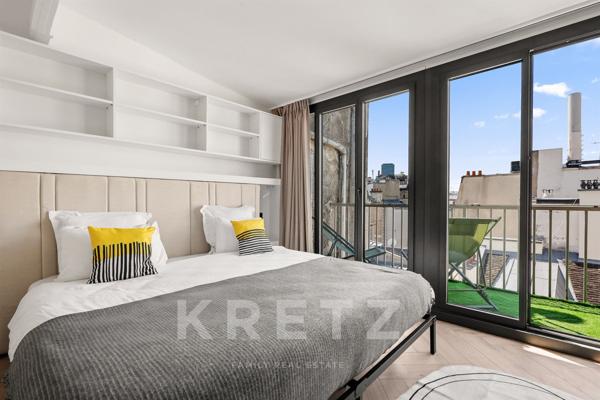 Appartement duplex en dernier étage avec blacon et terrasse sur l'Ile Saint Louis