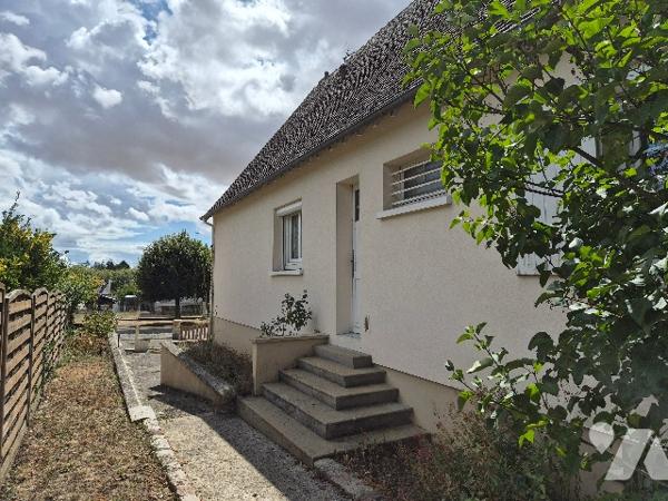 Une maison à usage d'habitation comprenant :