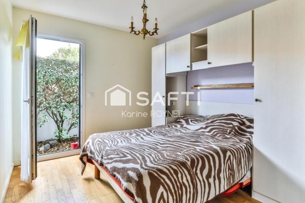 T3 en rez-de-jardin de 75 m², terrasse et jardin privatifs.